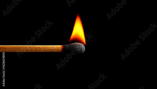 Ignite the Moment: A Matchstick Flame in Total Darkness Burns Bright