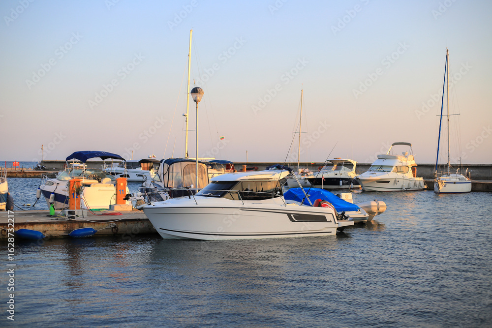 Fototapeta premium Motor boat is moored in the marina