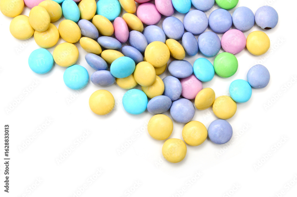 Closeup of colorful chocolate candies on white Closeup of colorful chocolate candies on white