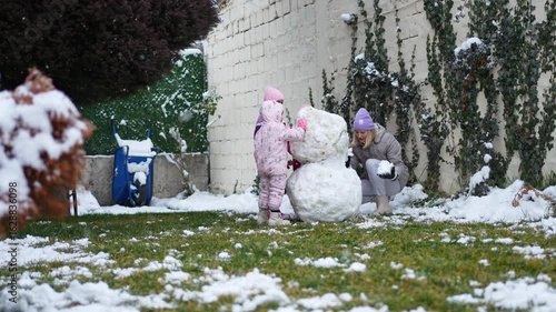 Creating a magical snowman in the cozy backyard wonderland