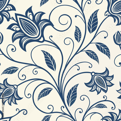 A seamless floral pattern with elegant blue flowers and vines on a soft cream background. Perfect for textiles, home decor, and stylish wallpapers.