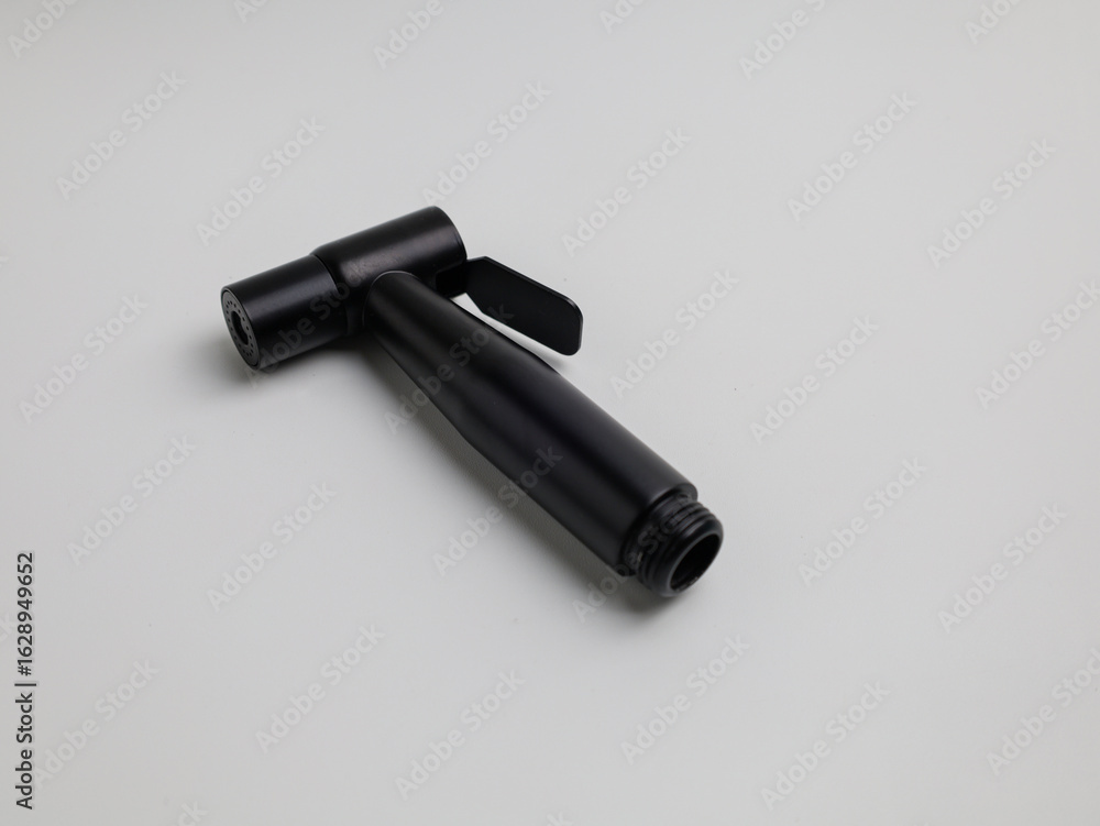 Black jet shower and stainless steel hose on white background Black jet shower and stainless steel hose on white background