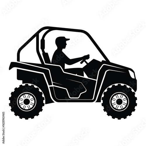 Silhouette of a person driving a side by side utility vehicle