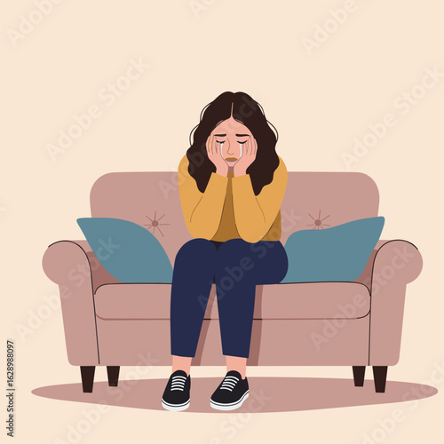 Woman sitting on sofa with hands on face looking sad indoors  