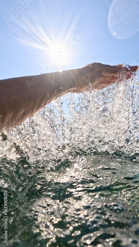 Pure sea water flowing from the hand.