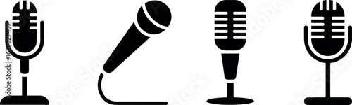 A collection of four stylized vintage microphones in black silhouette on a white background