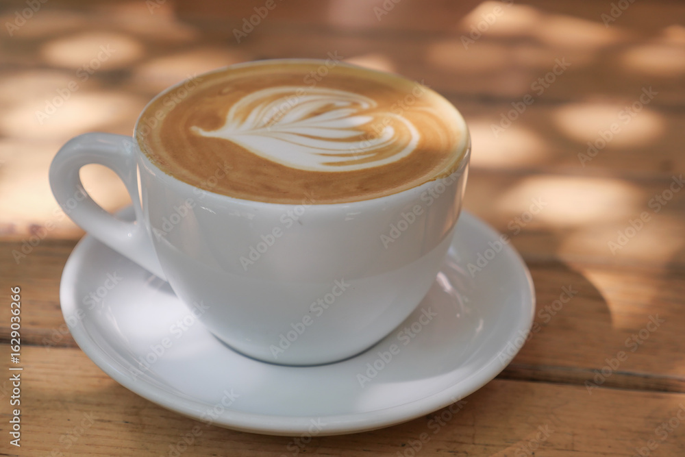 Fototapeta premium Warm latte art in a cozy cafe setting