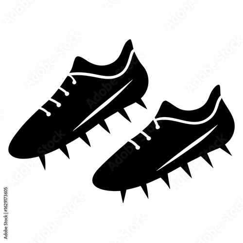 Pair of black silhouette football cleats with laces and spikes on white background