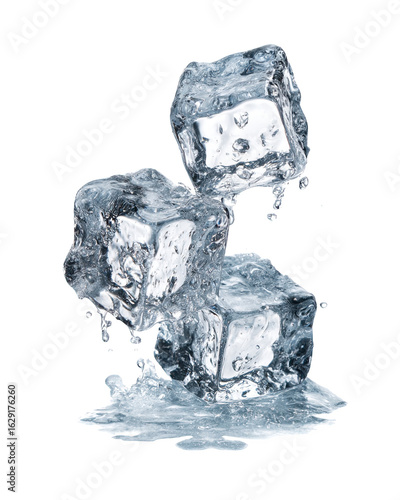 Three melting ice cubes on a surface with water droplets.