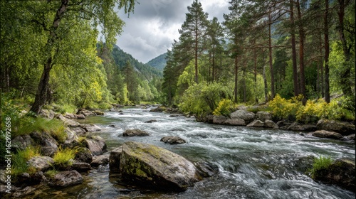 Crystal clear water rushes over smooth rocks in a vibrant green forest. Towering trees line the riverbanks, while distant mountains create a dramatic backdrop under an overcast sky.