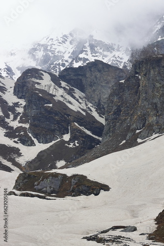 adventure travel in himalaya mountains, high altitude alpine valley covered with glacier at marhi near rohtang pass, manali, himachal pradesh, india