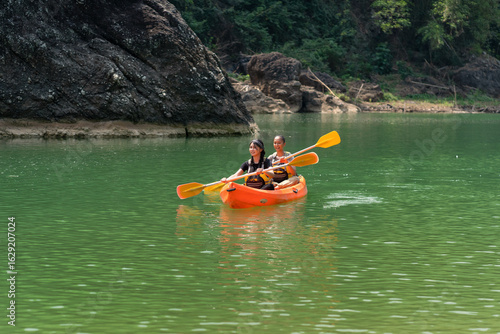 Wallpaper Mural Asian Women Canoeing on Oyo River in Yogyakarta Nature Escape Torontodigital.ca