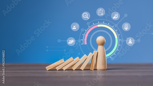 Tableau sur toile Leadership and risk management concept with wooden figure stopping dominoes and