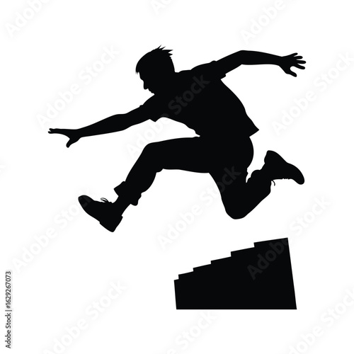 Silhouette of a man leaping over stairs in a dynamic action pose