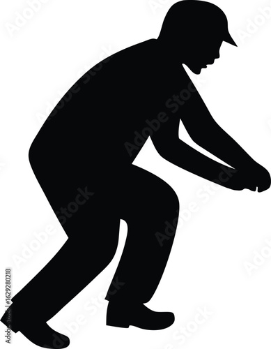 A black silhouette of a man wearing a cap, bending down in a crouching position.