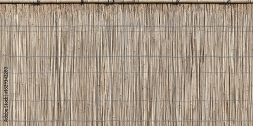 Tan reed fence with thin wire horizontal supports