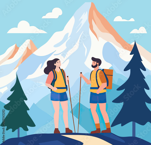 Couple hikers with backpacks and trekking poles standing on mountain trail surrounded by pine trees and snowy mountain peaks under blue sky