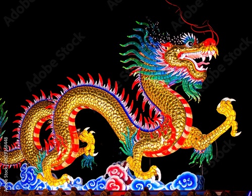 Wallpaper Mural Illuminated dragon sculpture, vibrant colors, detailed scales and claws, against a dark background Torontodigital.ca