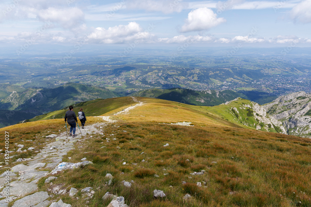 Obraz premium Hikers on a Mountain Ridge