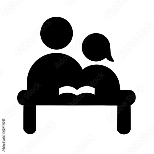 Black silhouette icon of adult and child reading at table with open book in modern flat vector style
