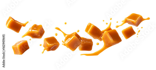 Caramel pieces and caramel splash flying in the air isolated on a transparent background