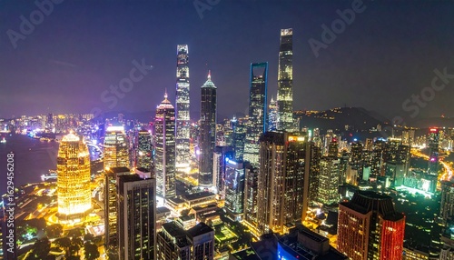 Wallpaper Mural Modern Cityscape at Night – High-Resolution Urban Skyline with Tall Buildings, Illuminated Skyscrapers, Glowing Windows, Dark Blue Sky, and Vibrant Night Lights in a Futuristic Metropolis Scene Torontodigital.ca
