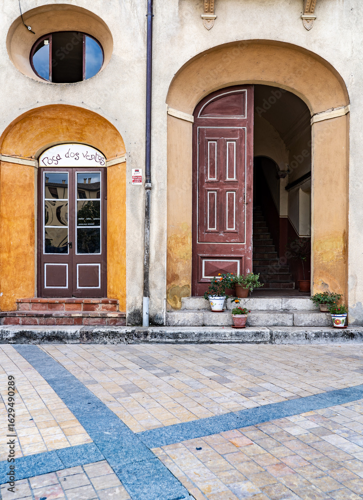 Fototapeta premium Rustic Arched Doorways with Potted Plants, in Besalu, spain