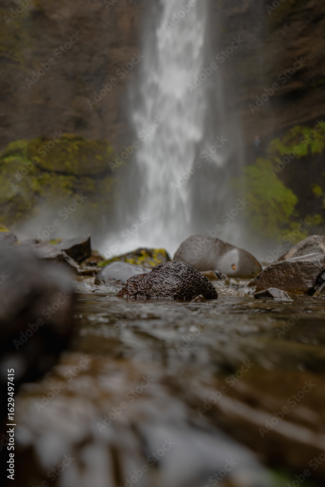 Fototapeta premium Close Up of Rocky Stream Leading to a Waterfall in Iceland