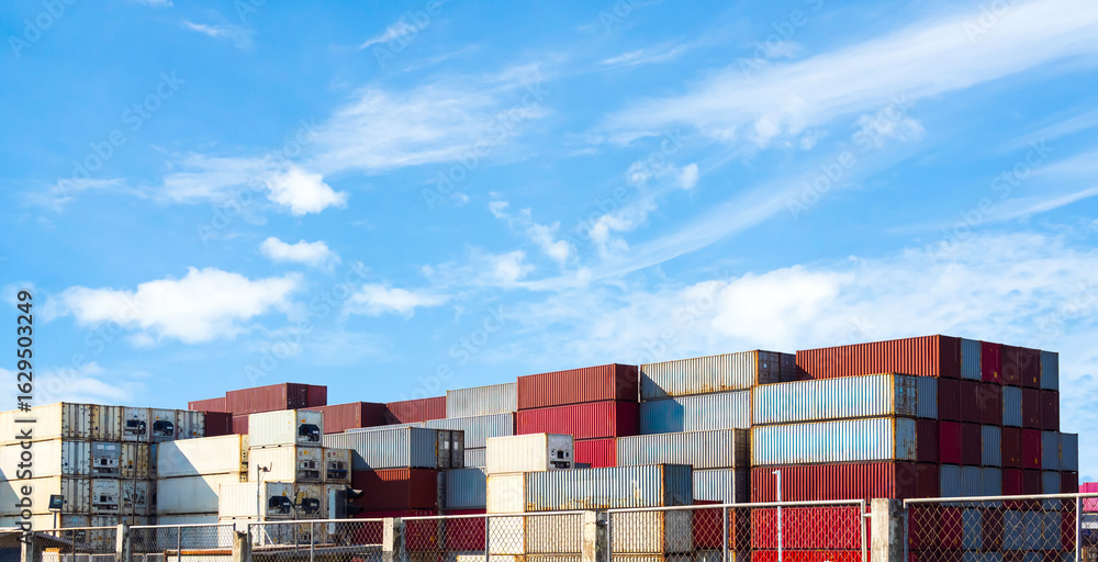 Obraz premium Cargo ship container goods export import international transport on blue sky background, warehouse industry business logistics transportation harbor port industrial shipping terminal cargo ship.
