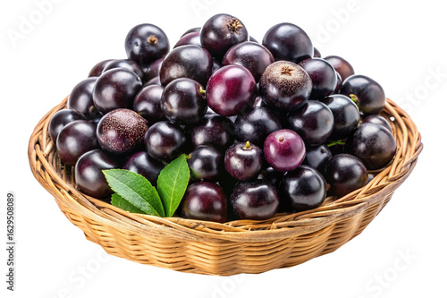 Wallpaper Mural Jabuticaba fruit in a woven basket with green leaves, isolated on white Torontodigital.ca