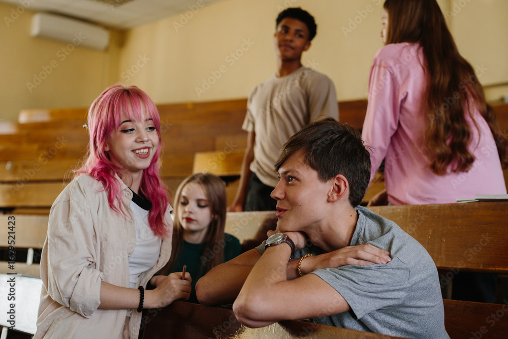 Obraz premium Group of Young Students Socializing in a Classroom Setting