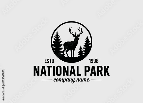 An iconic national park logo showcasing a majestic deer among trees, symbolizing nature conservation and the beauty of wildlife in a harmonious natural habitat.