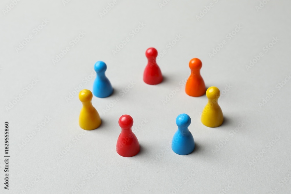 Obraz premium Board game figures and one another on a pastel background 