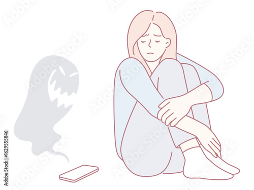 A young woman sits in distress, deeply reflecting the anxiety that is often linked to technology and social media usage