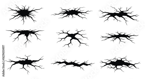 Collection of nine black abstract crack patterns and textures representing damage or fragmentation