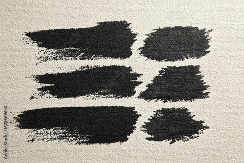 Black paint strokes on textured canvas surface eps