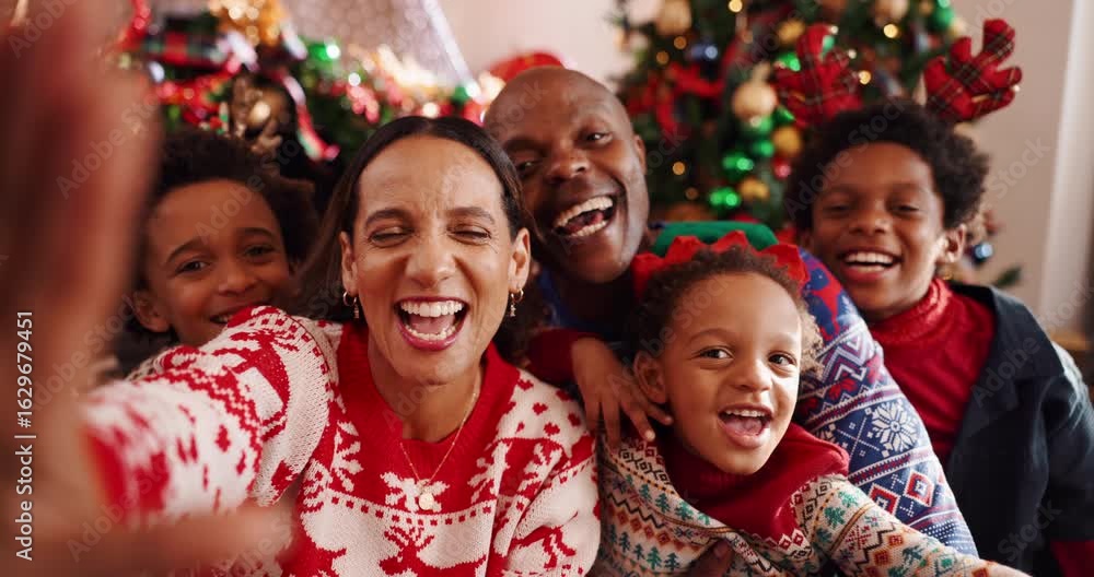Face, family or selfie for Christmas, home or profile picture for festive season, bonding and love. Laughing, parents and photography POV with children on Xmas, African people or celebration in house Face, family or selfie for Christmas, home or profile picture for festive season, bonding and love. Laughing, parents and photography POV with children on Xmas, African people or celebration in house