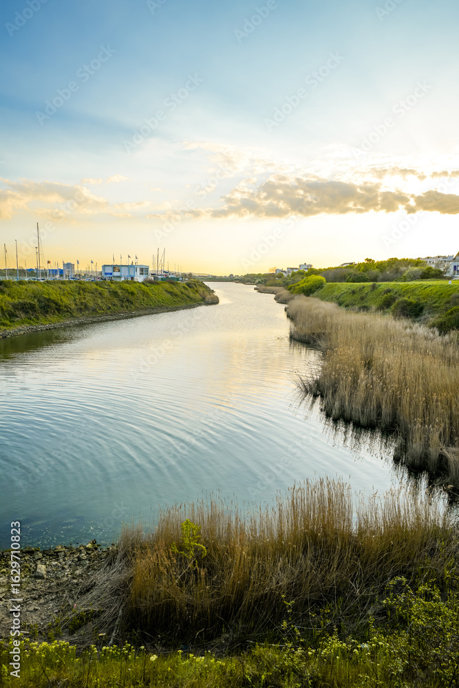 Fototapeta premium View of the canal in Calais. Landscape in the evening. 