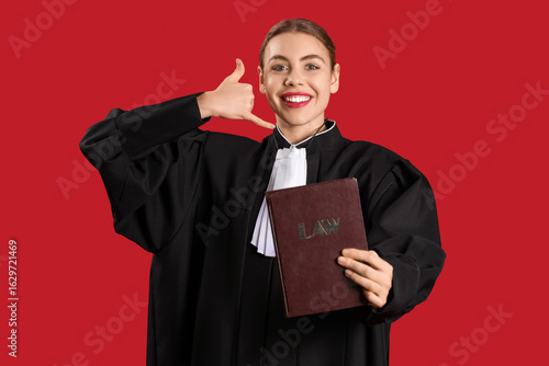 Young judge with law book s...