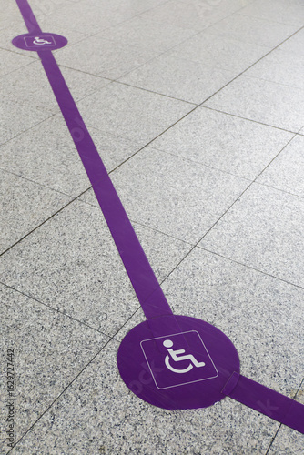 Floor decals for person with disability track at airport.