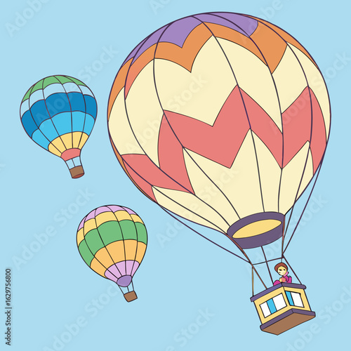 Three colorful hot air balloons with a person in the basket floating in a clear blue sky