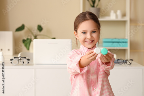 Cute little girl with conta...