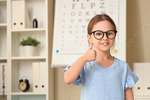 Cute little girl with eyegl...