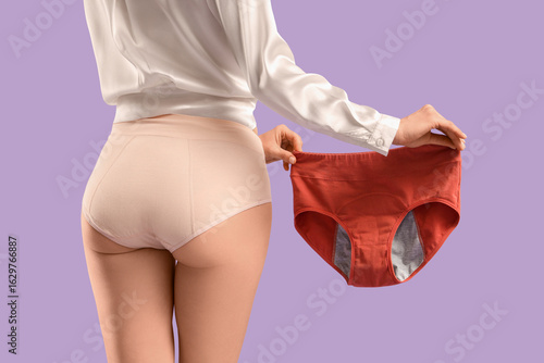 Young woman with menstrual ...