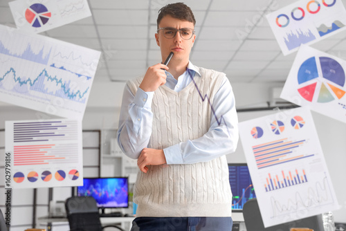 Thoughtful male trader look...