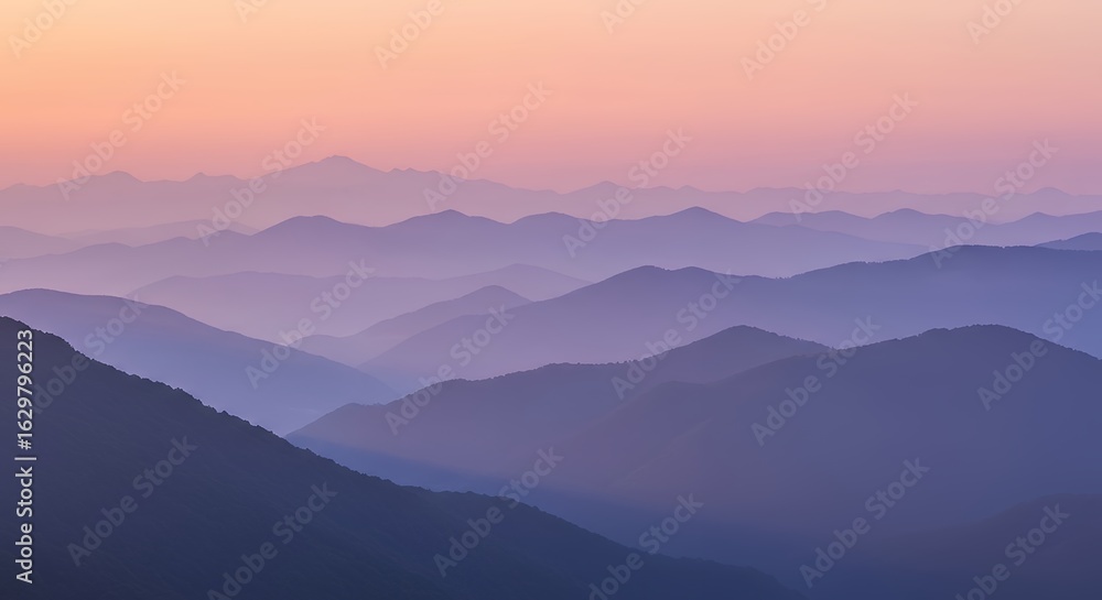 Obraz premium Colorful Mountain Range at Sunset with Pink Orange Sky and Layered Hills
