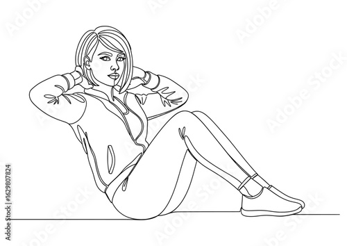  Woman doing sit-ups, a core-strengthening exercise for abdominal muscles.