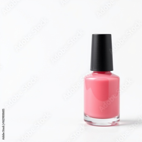 A clean and minimalistic image featuring a pink nail polish bottle isolated on the right side of the frame