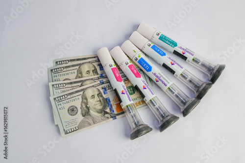 Basra, Iraq - August 5, 2025: Mounjaro Pens and Money Representing High Cost of Medicin