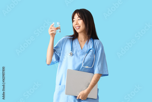 Female Asian doctor with gl...